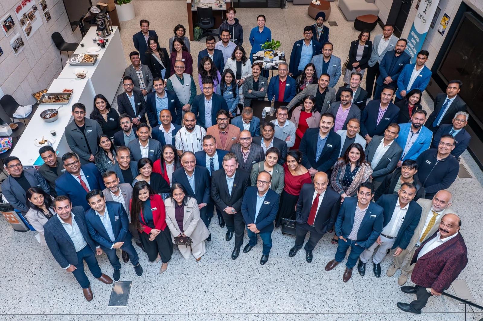 Artha members and mentors together for a group photo at the Business Roundtable.