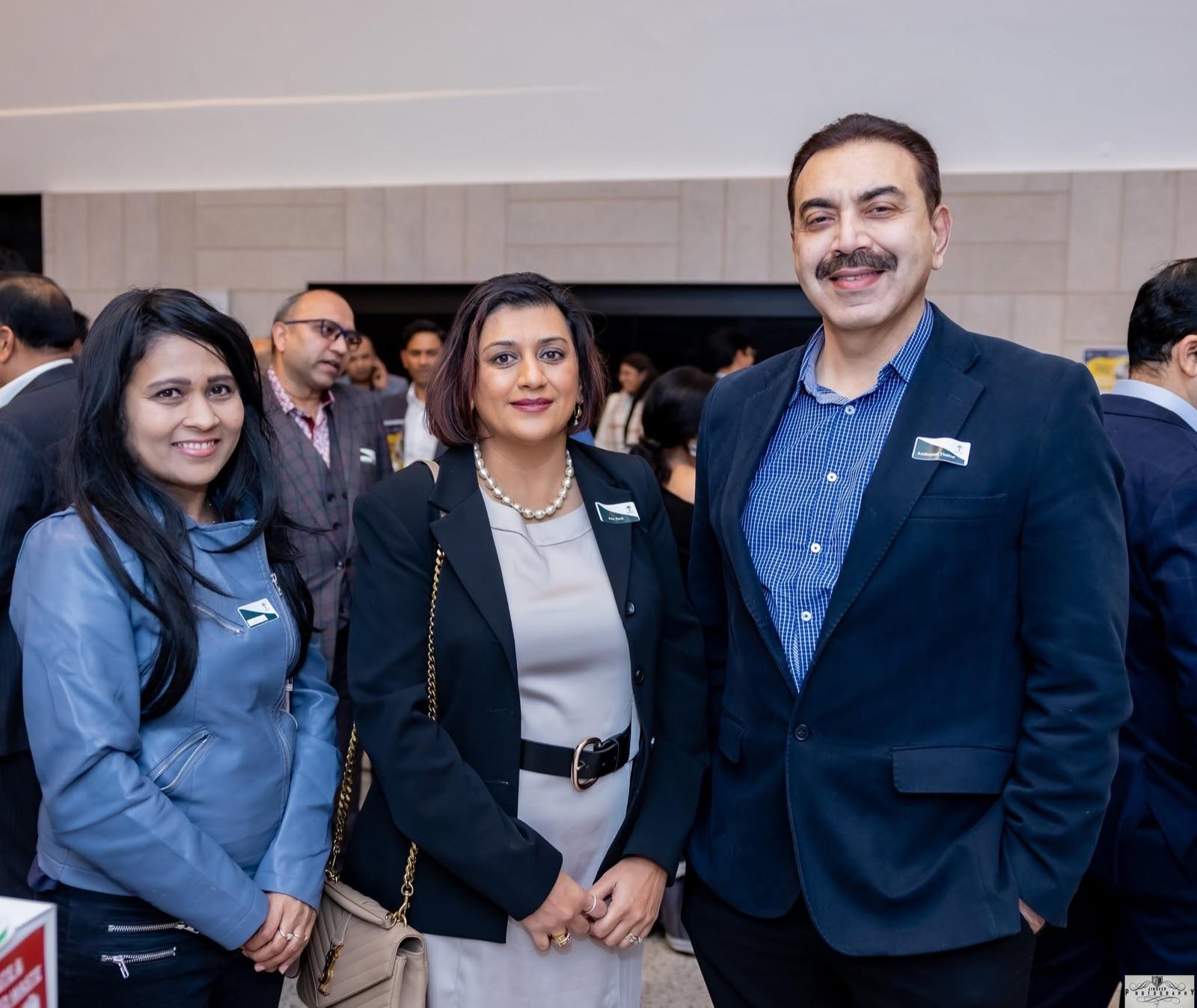 Members smiling together at the Artha Business Roundtable.
