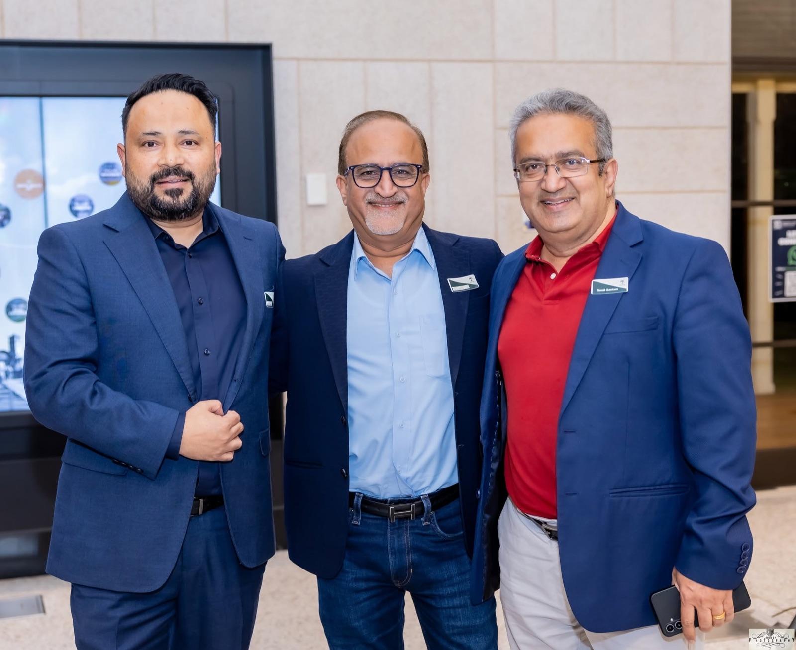 Three members at the Artha Business Roundtable.